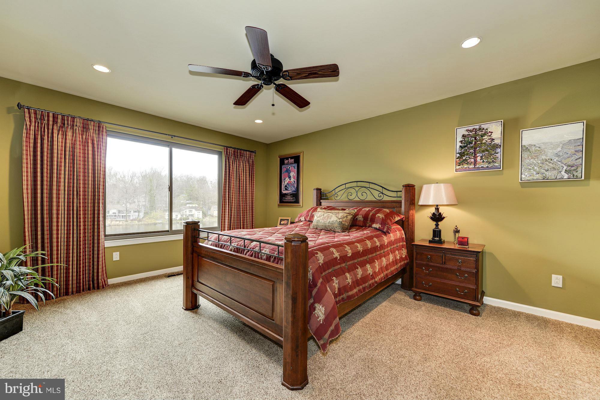 11076 Thrush Ridge Road Reston, VA 20191 - Photo 12 of 29 a bedroom with a bed and a large window