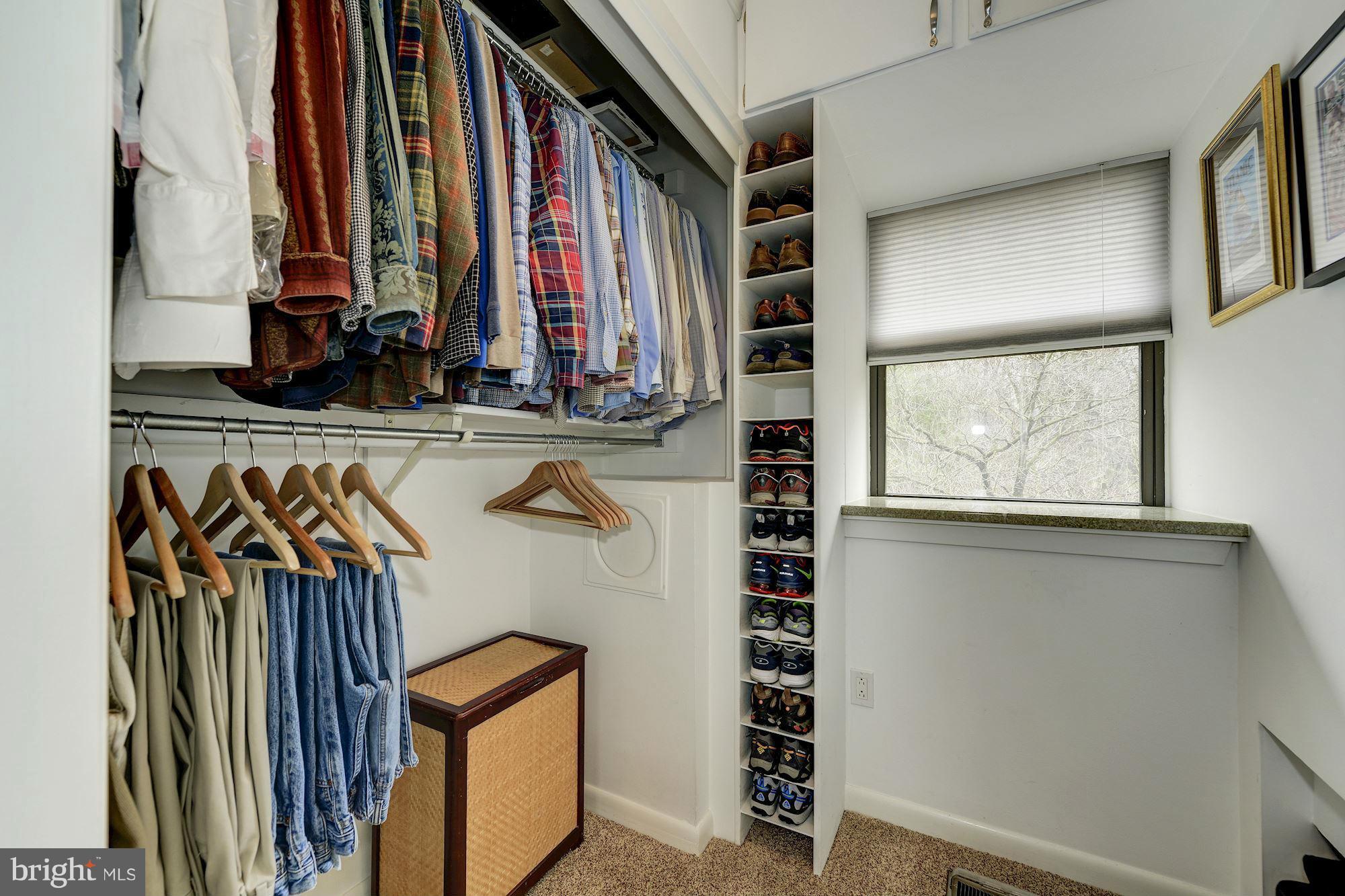 11076 Thrush Ridge Road Reston, VA 20191 - Photo 13 of 29 a view of walk in closet with clothes and shoes