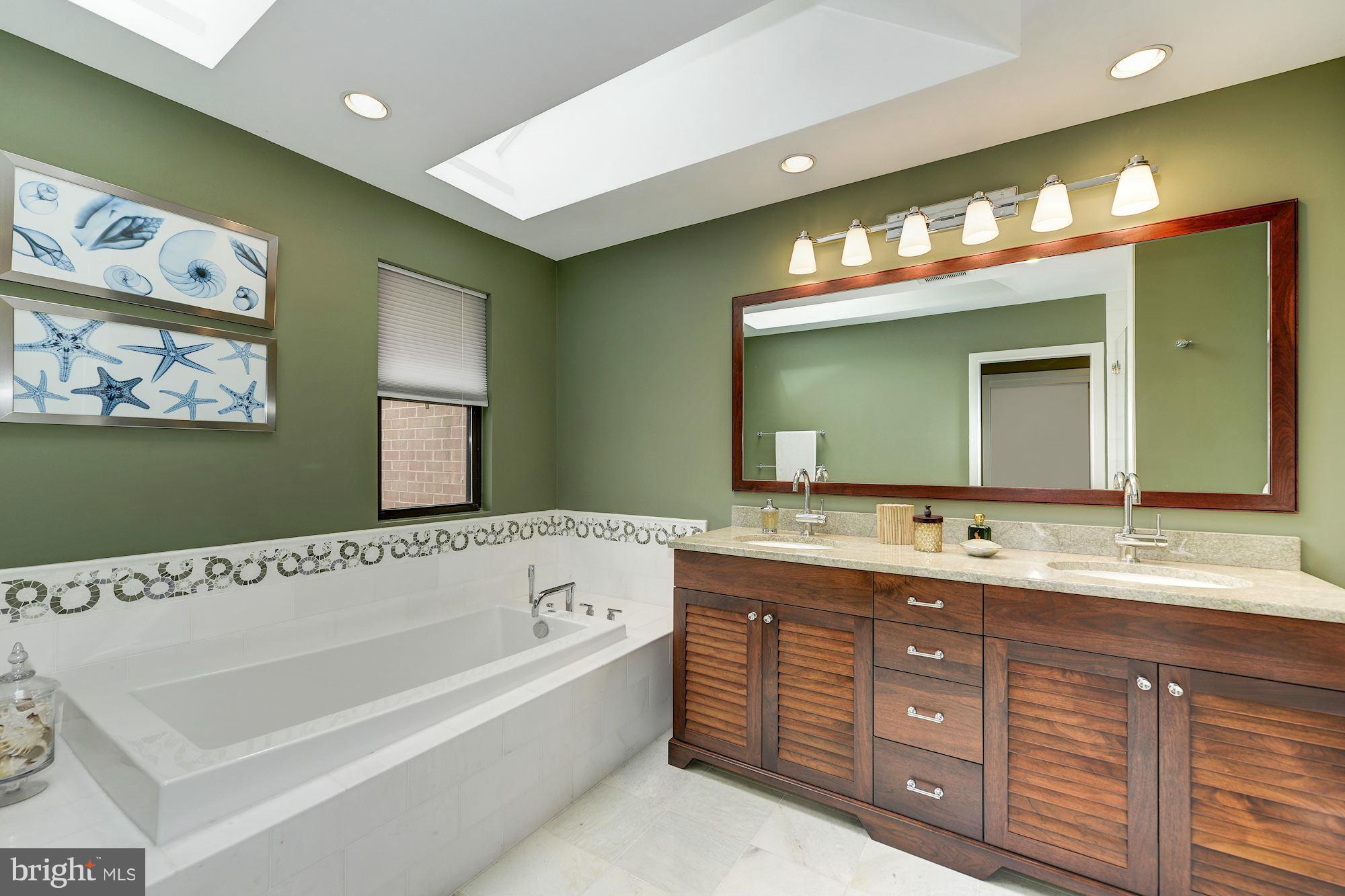 11076 Thrush Ridge Road Reston, VA 20191 - Photo 14 of 29 a bathroom with a granite countertop double vanity sink and a large mirror