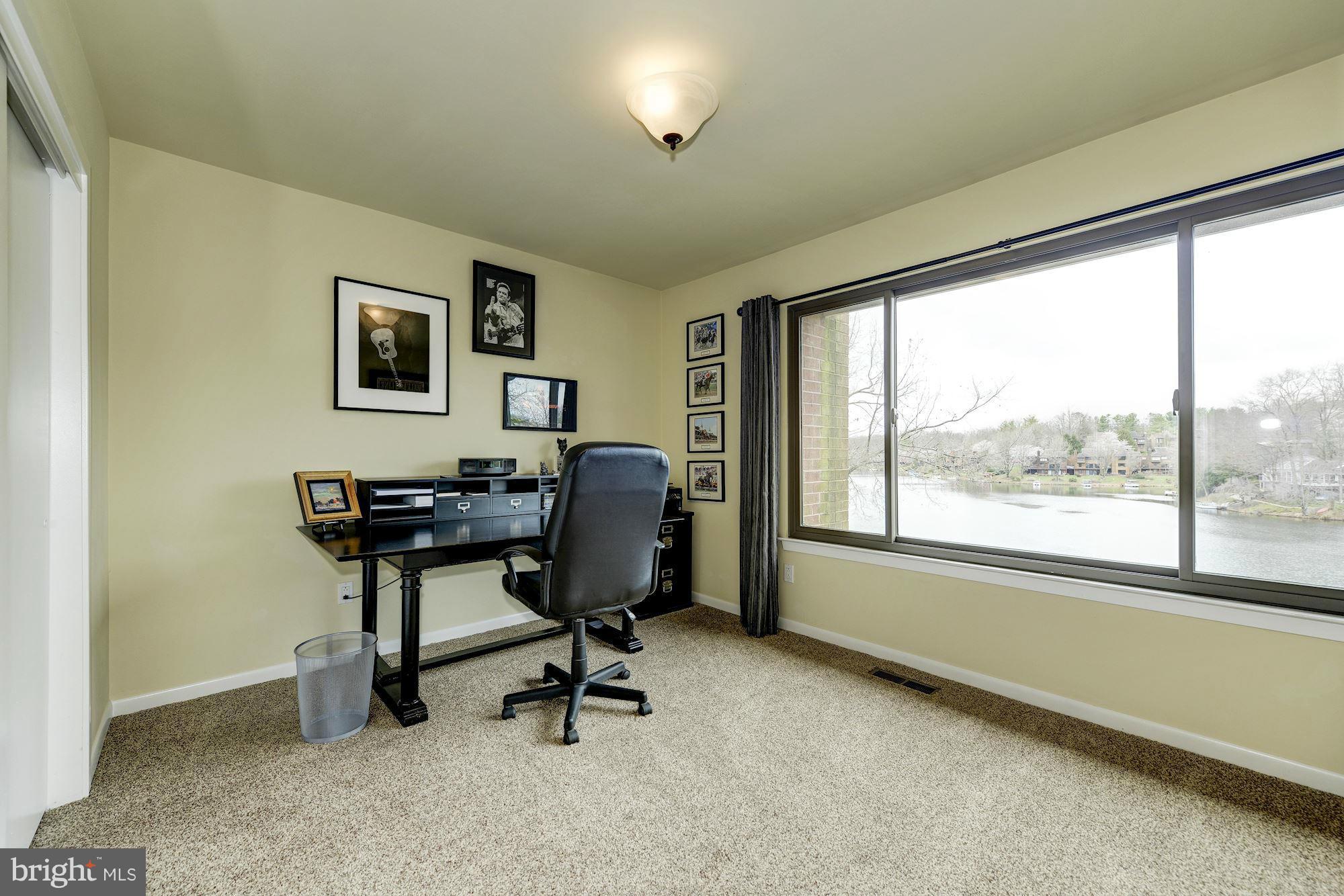 11076 Thrush Ridge Road Reston, VA 20191 - Photo 16 of 29 a view of a workspace with furniture and a window