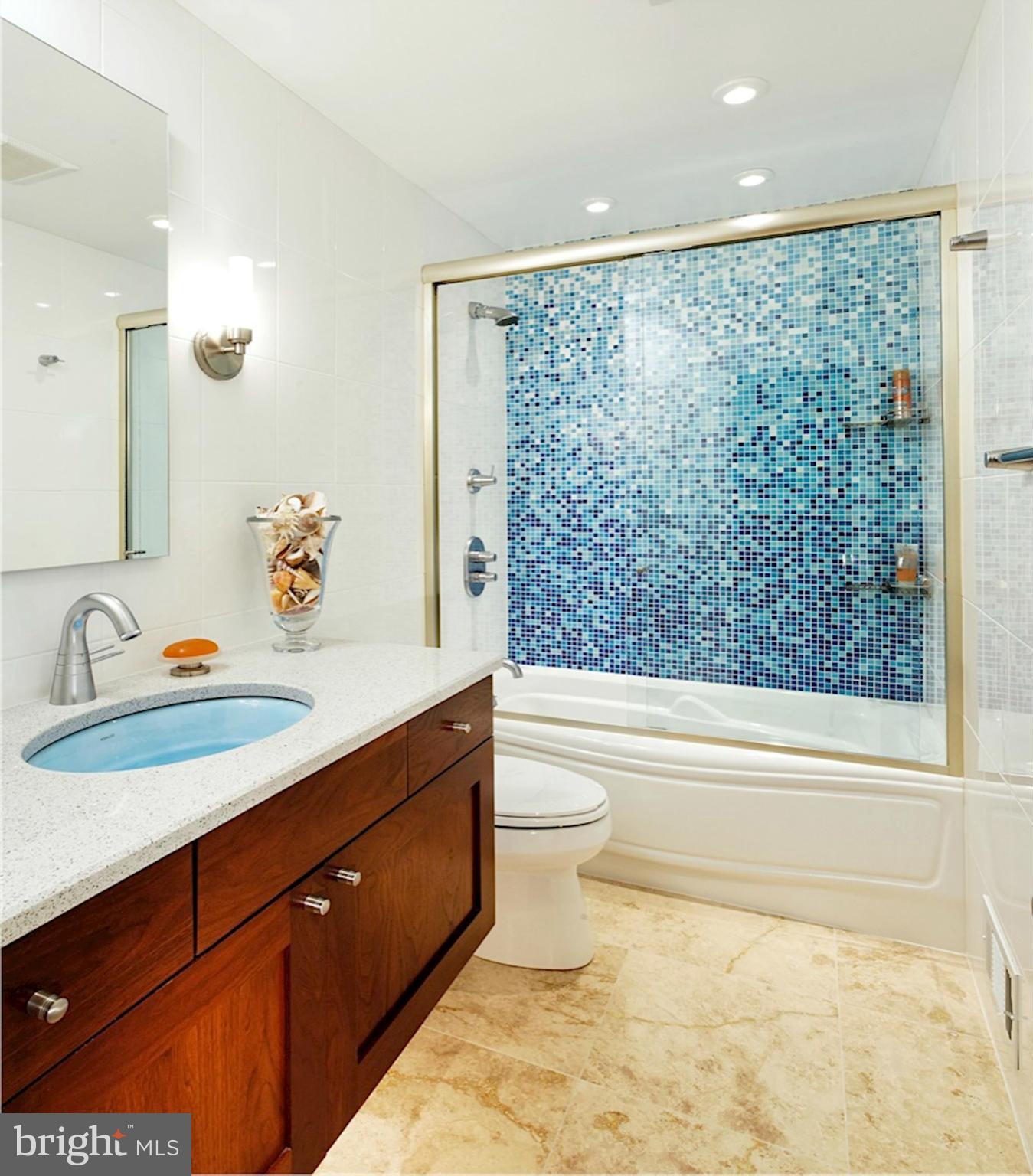11076 Thrush Ridge Road Reston, VA 20191 - Photo 17 of 29 a bathroom with a granite countertop sink toilet and shower
