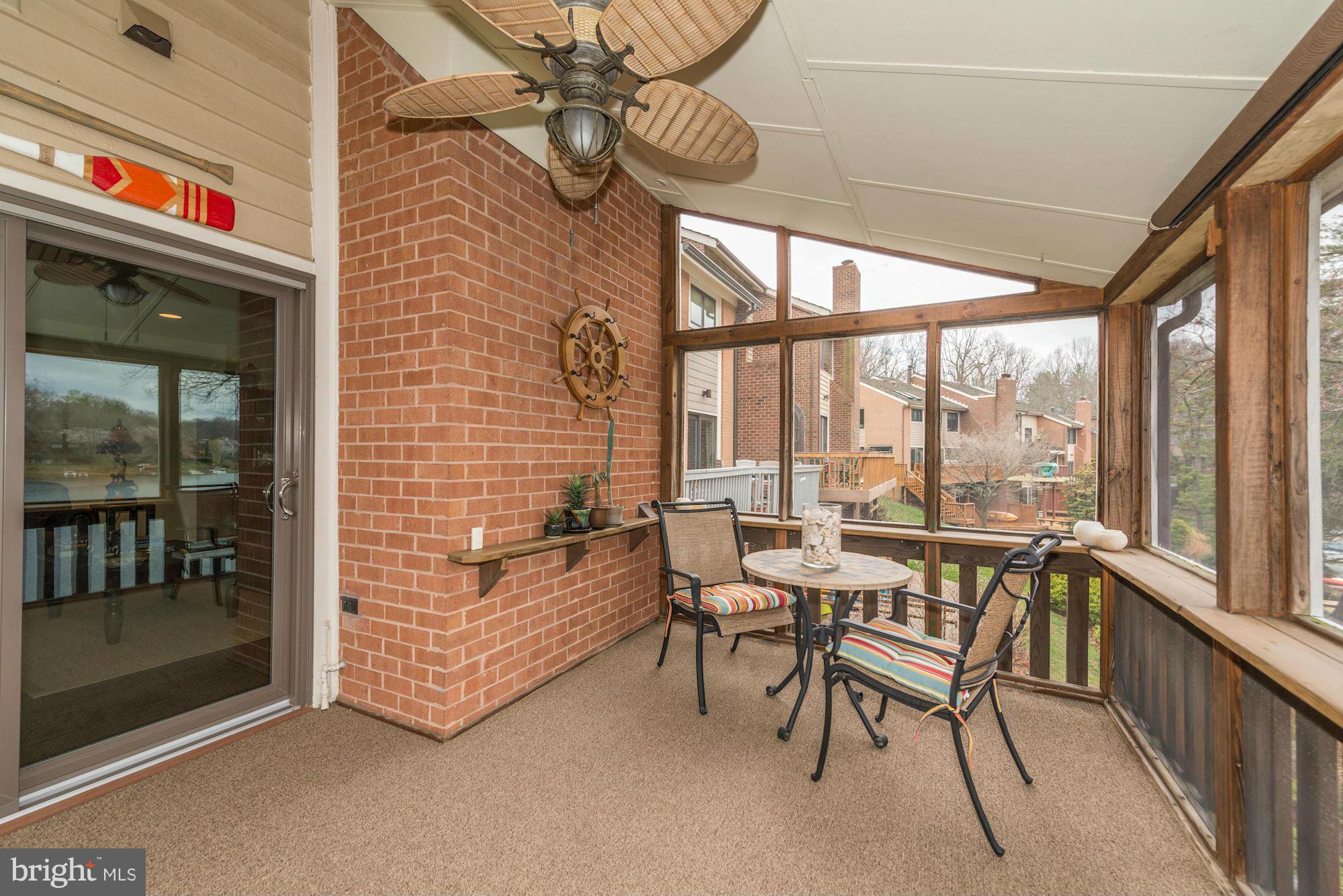 11076 Thrush Ridge Road Reston, VA 20191 - Photo 3 of 29 a view of a room with chairs and table in front of a building