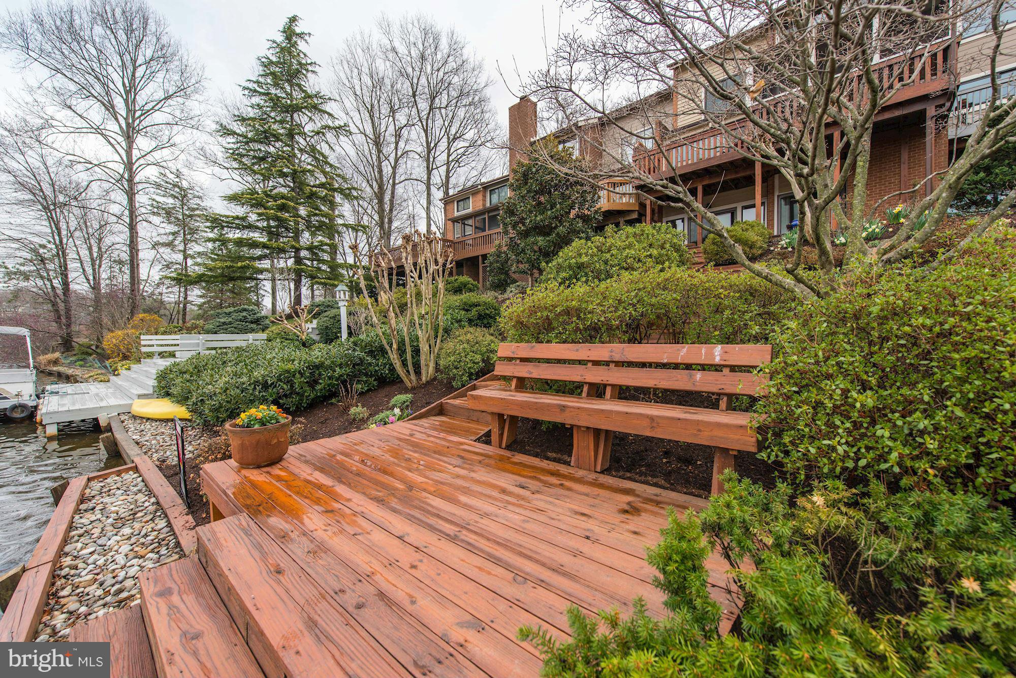 11076 Thrush Ridge Road Reston, VA 20191 - Photo 25 of 29 a yard with a bench and trees