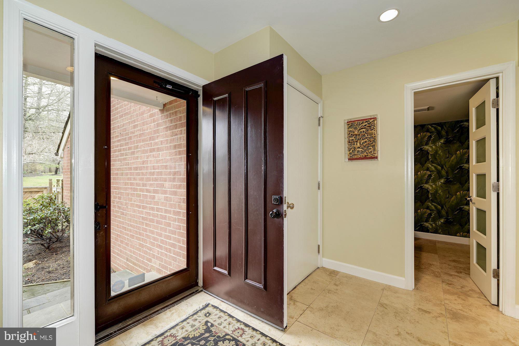 11076 Thrush Ridge Road Reston, VA 20191 - Photo 4 of 29 a view of a hallway with a glass door
