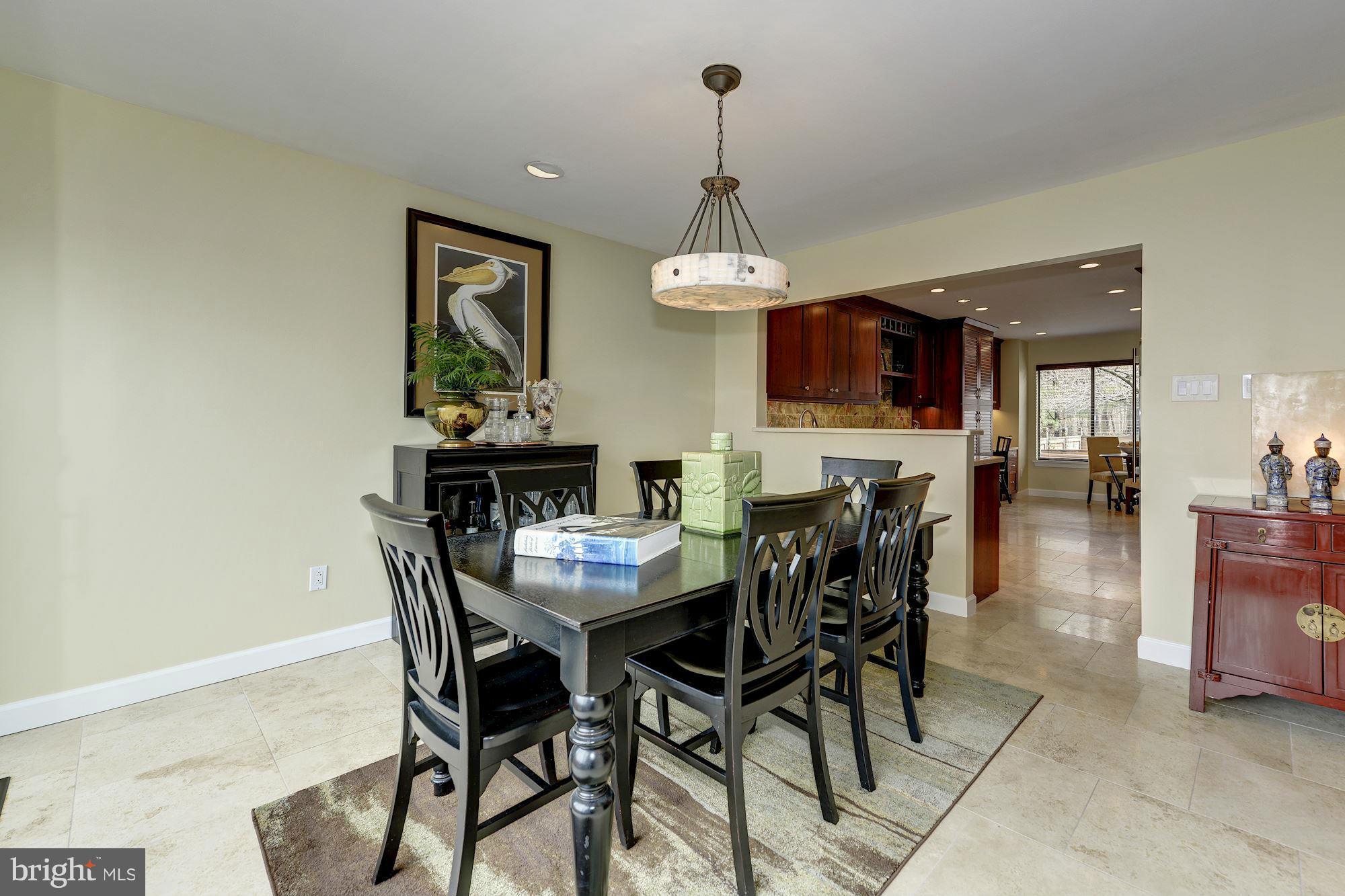 11076 Thrush Ridge Road Reston, VA 20191 - Photo 8 of 29 a view of a dining room with furniture window and wooden floor