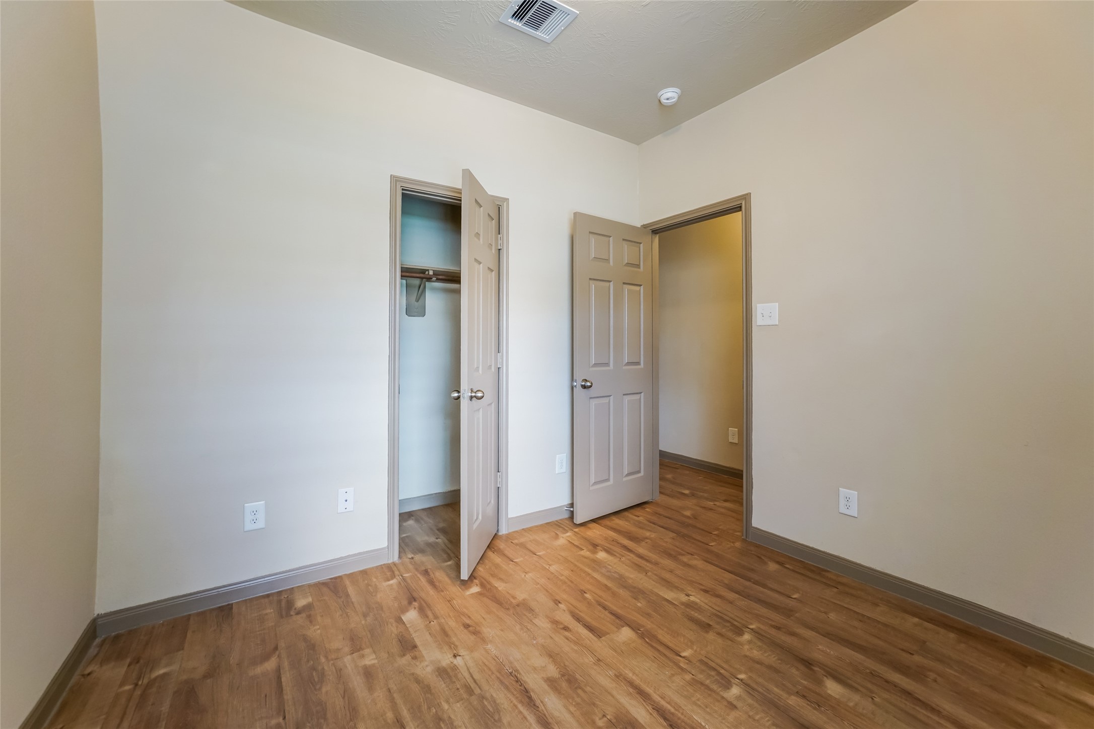 21811 South Werrington Way Houston, TX 77073 - Photo 12 of 13 a view of an empty room with wooden floor