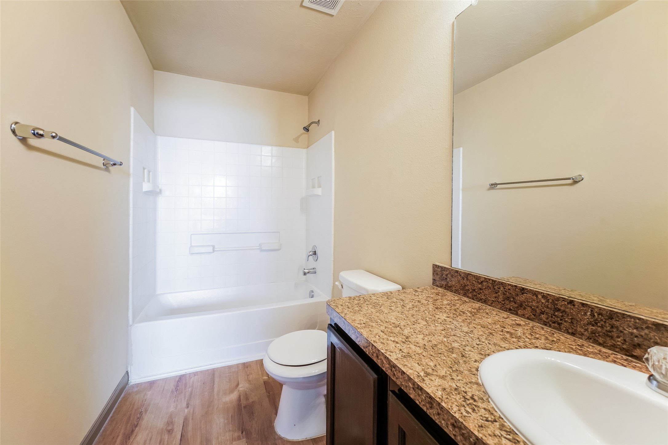 21811 South Werrington Way Houston, TX 77073 - Photo 8 of 13 a bathroom with a granite countertop sink a toilet and shower