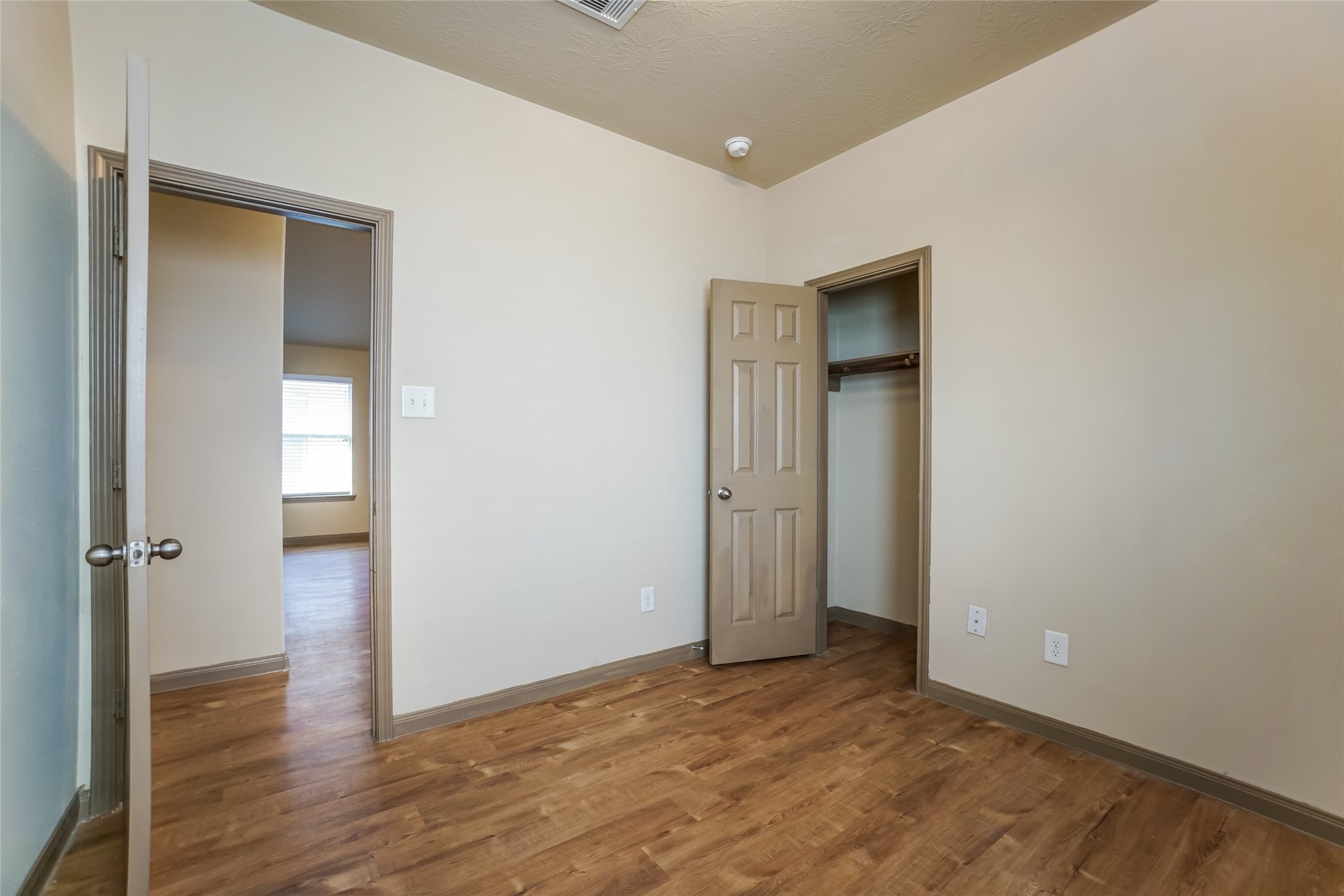 21811 South Werrington Way Houston, TX 77073 - Photo 10 of 13 an empty room with wooden floor and closet