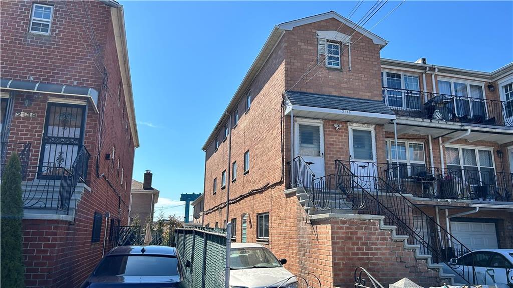 2136 East 69th Street Brooklyn, NY 11234 - Photo 2 of 10 a front view of a house with a yard
