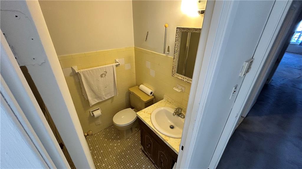 2136 East 69th Street Brooklyn, NY 11234 - Photo 9 of 10 a bathroom with sink and a tub