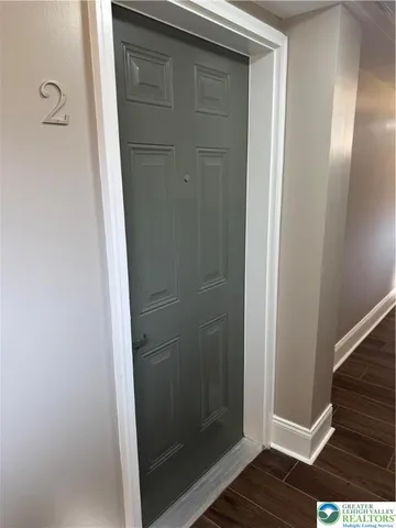 a bathroom with a glass door shower