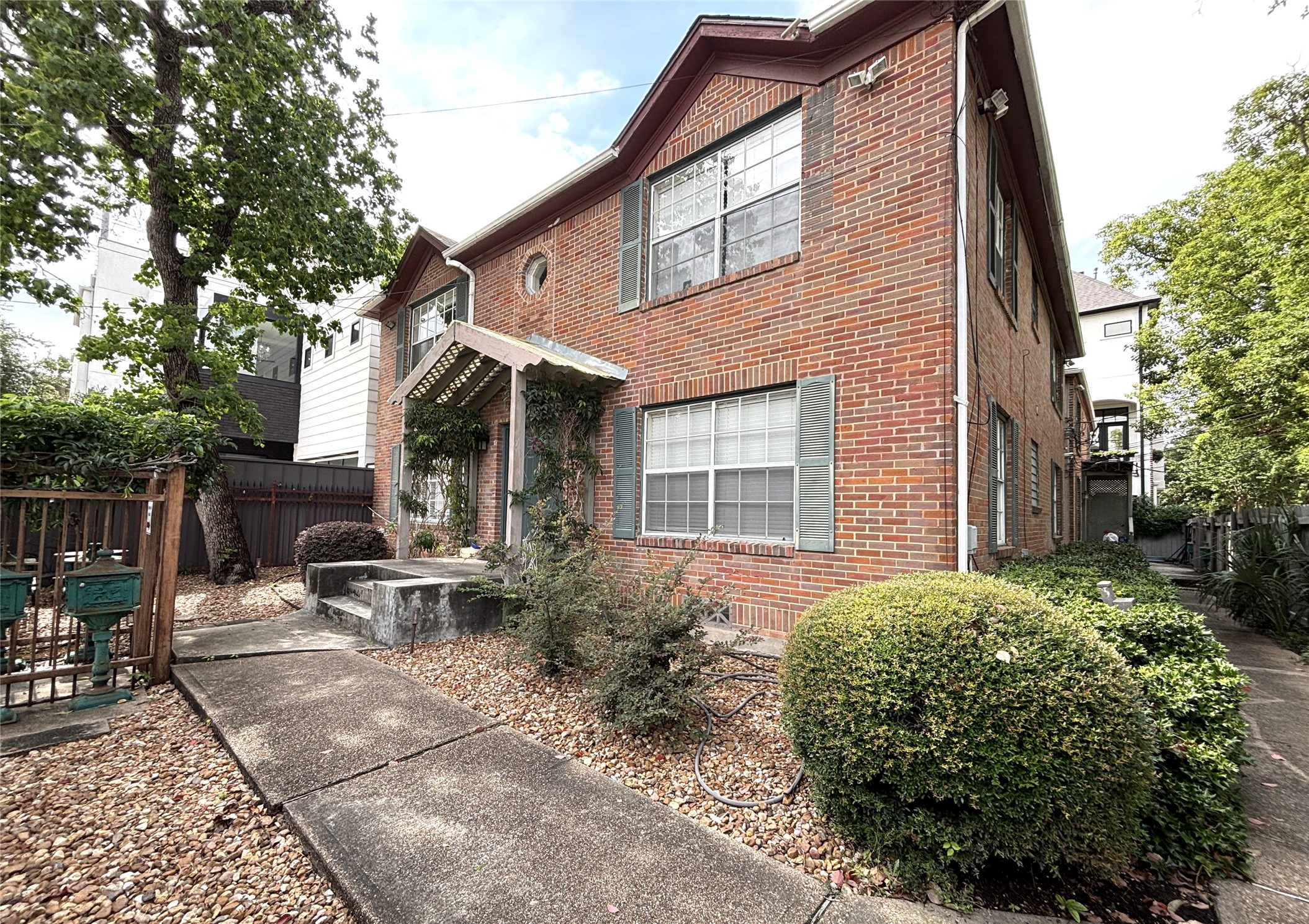 1840 Branard Street, Unit 2 Houston, TX 77098 - Photo 2 of 12 Fourplex shown from inside the gate.