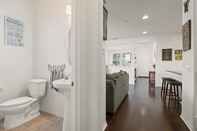 a bathroom with a sink toilet and a mirror