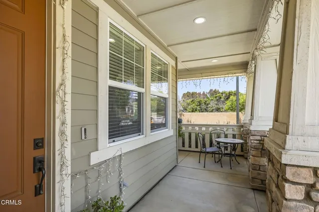 a kitchen with granite countertop a sink stainless steel appliances and cabinets