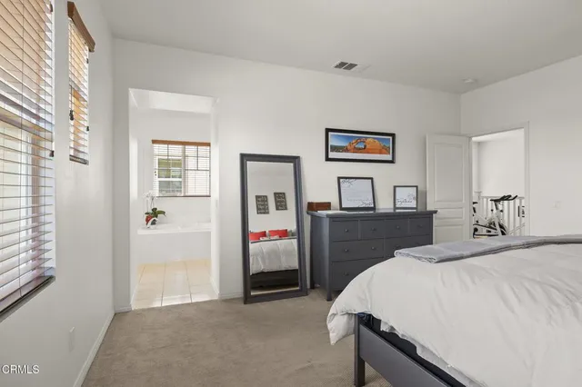 a white bath tub sitting next to a white toilet
