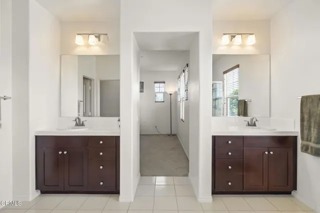 a view of walk in closet with clothes