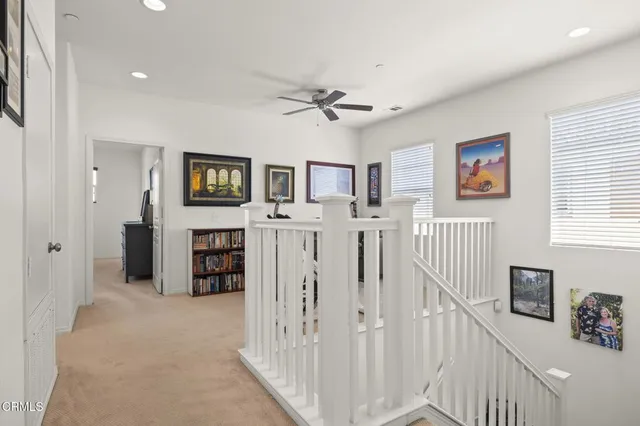 a bed room with a bed and a chair