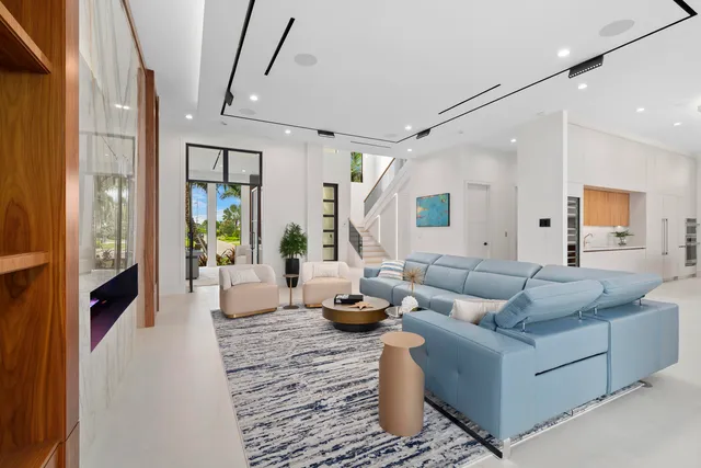 a spacious bedroom with a large bed and a large window