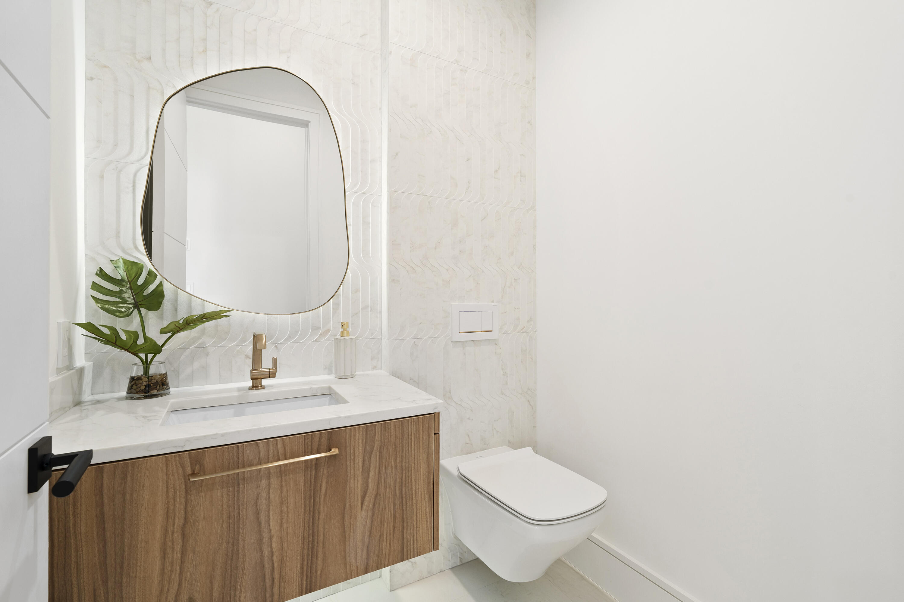 2880 Northeast 9th Street Pompano Beach, FL 33062 - Photo 22 of 61 a bathroom with a granite countertop toilet sink and mirror