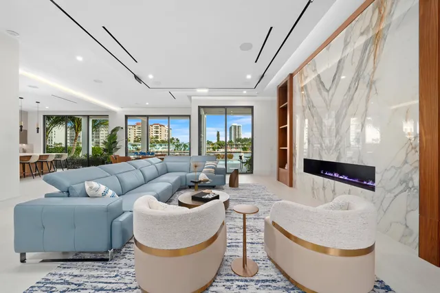 a kitchen with stainless steel appliances kitchen island granite countertop a table and chairs in it