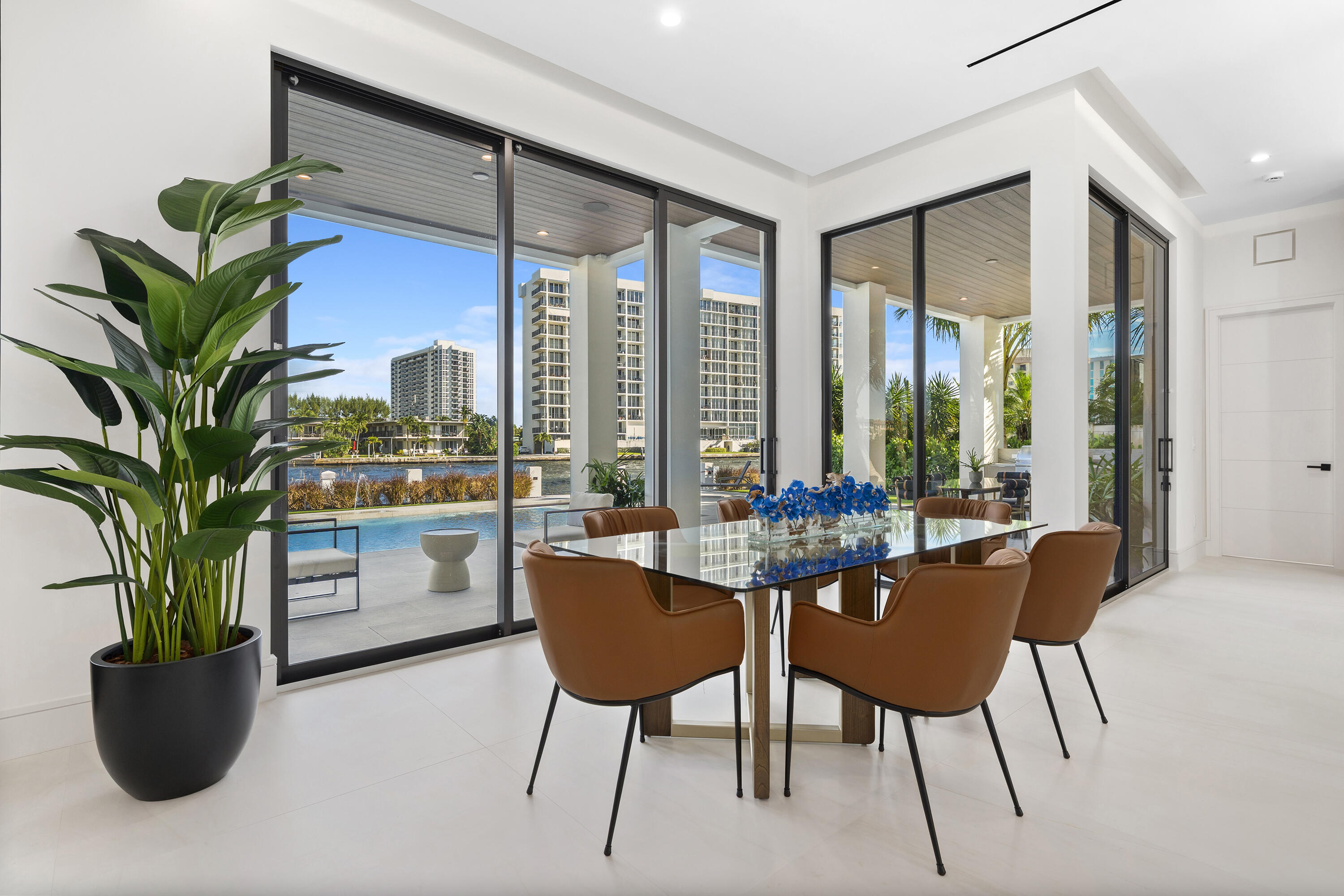 2880 Northeast 9th Street Pompano Beach, FL 33062 - Photo 25 of 61 a dining room with furniture and a potted plant