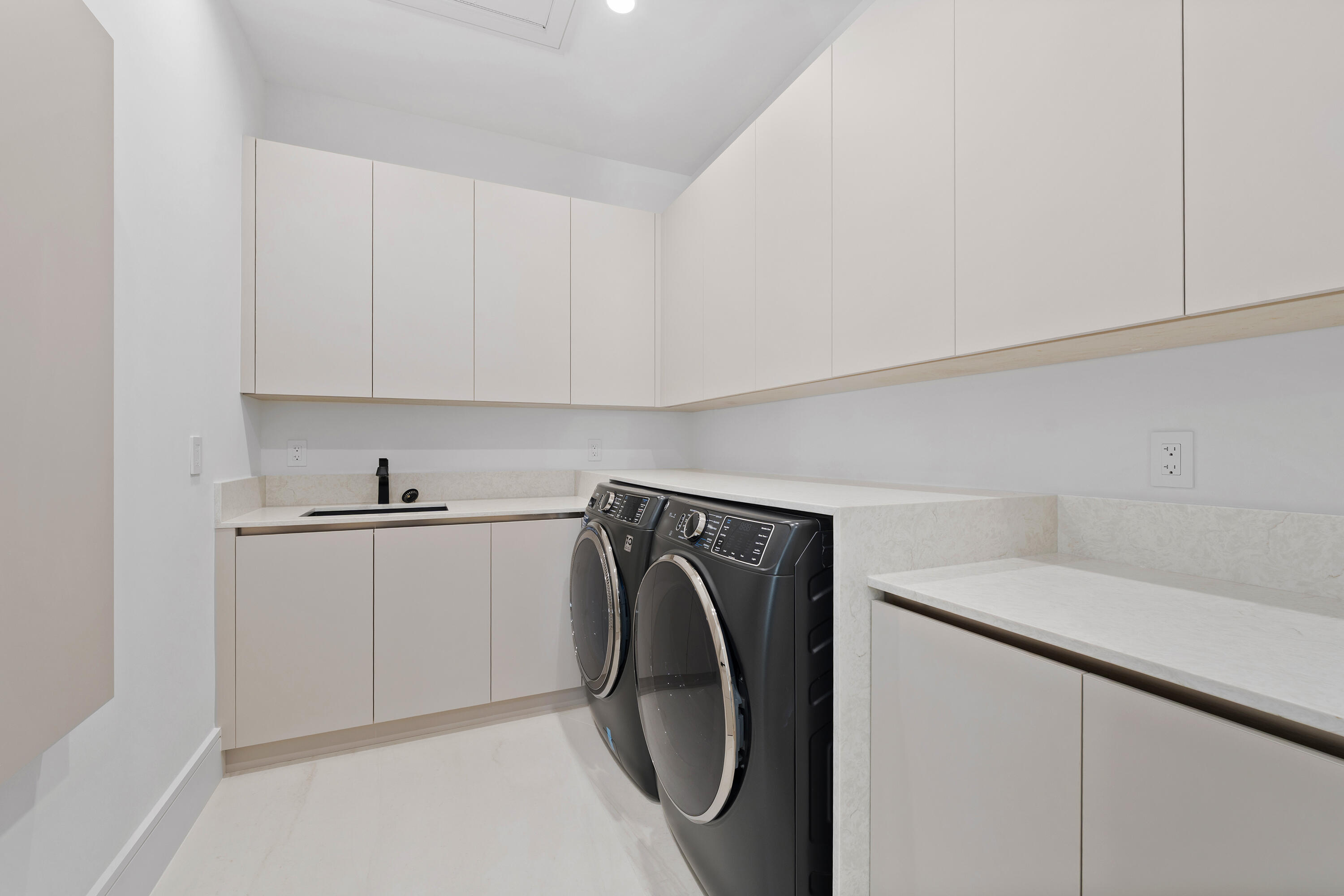 2880 Northeast 9th Street Pompano Beach, FL 33062 - Photo 61 of 61 a utility room with dryer and washer