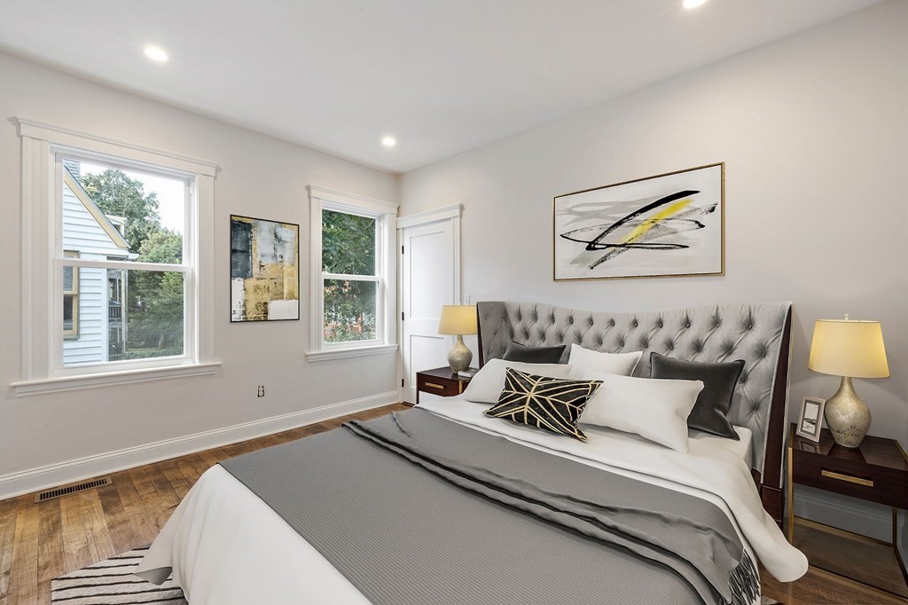 21 Alpha Road, Unit 1 Boston, MA 02124 - Photo 11 of 24 a bedroom with bed and window