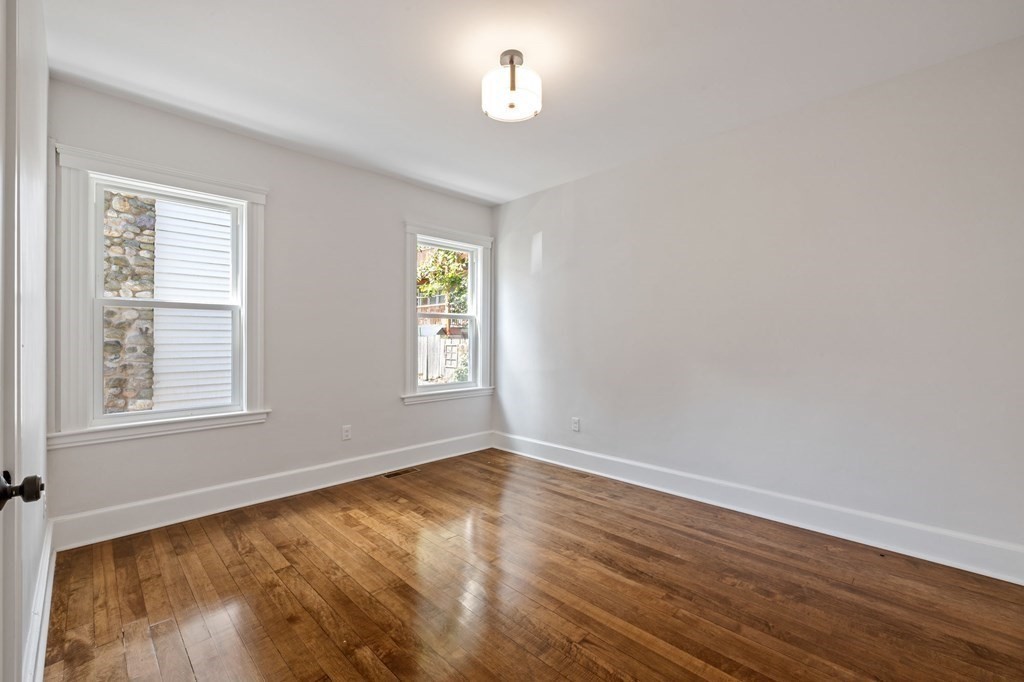 21 Alpha Road, Unit 1 Boston, MA 02124 - Photo 22 of 24 an empty room with a window