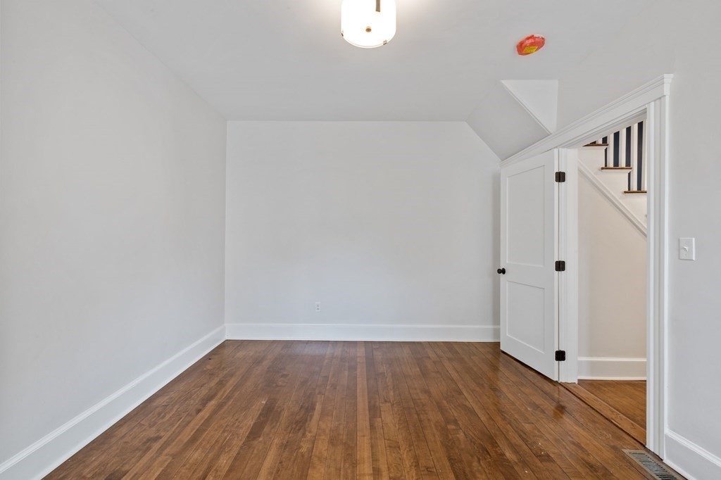 21 Alpha Road, Unit 1 Boston, MA 02124 - Photo 23 of 24 a view of a room with wooden floor