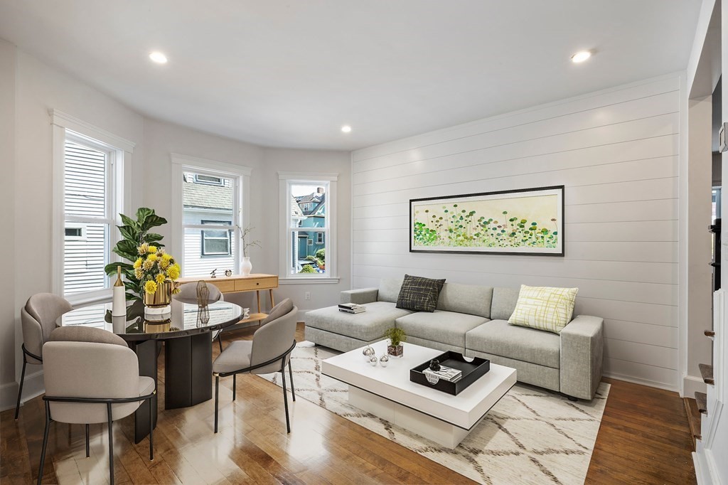 21 Alpha Road, Unit 1 Boston, MA 02124 - Photo 6 of 24 a living room with furniture and a wooden floor