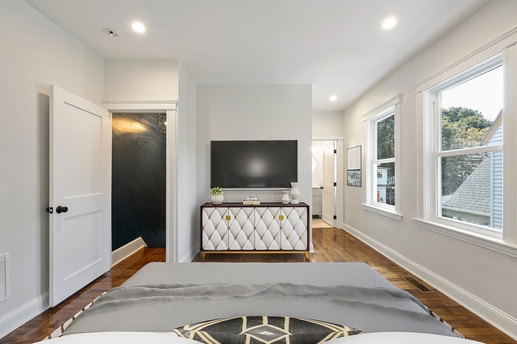 21 Alpha Road, Unit 1 Boston, MA 02124 - Photo 10 of 24 a living room with furniture and a flat screen tv