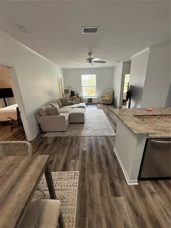 a view of living room with furniture and flat screen tv