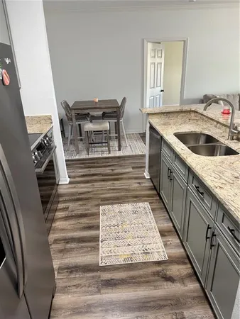 a bathroom with sink and washing machine