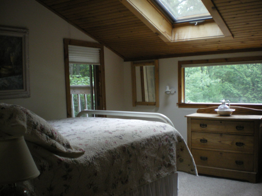 10 Norwalk Acres Road Monterey, MA 01245 - Photo 9 of 9 a bed sitting in a bedroom next to a window