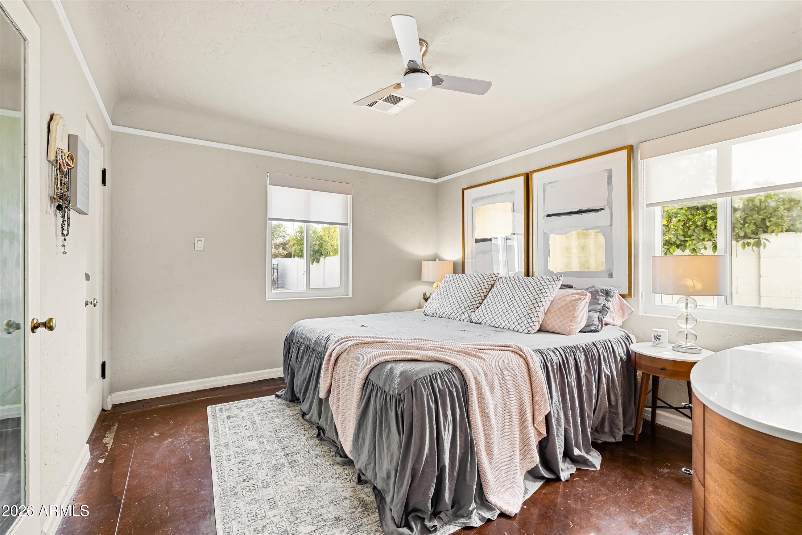 537 Virginia Avenue Phoenix, AZ 85003 - Photo 14 of 32 a bedroom with a bed and a chandelier