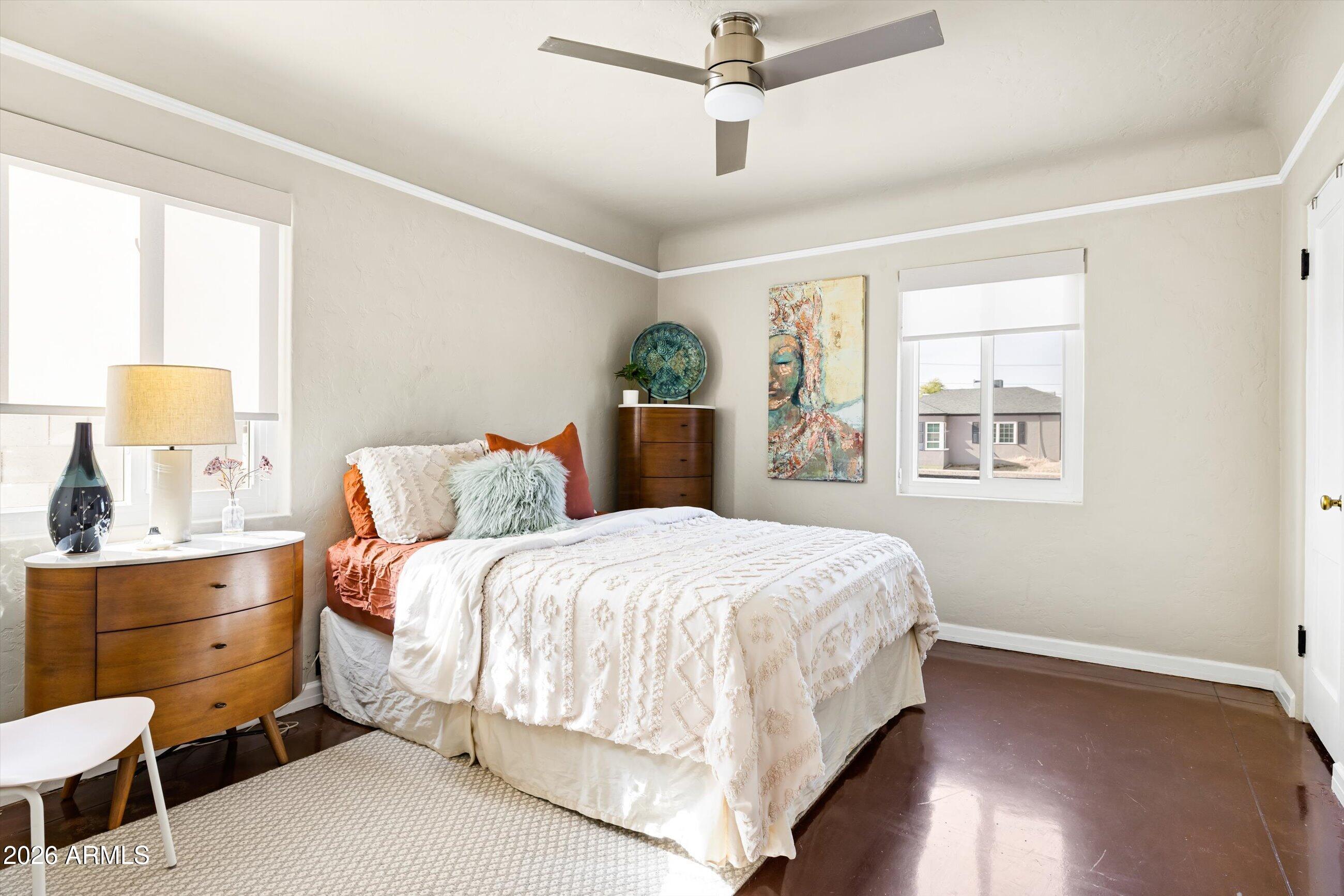 537 Virginia Avenue Phoenix, AZ 85003 - Photo 19 of 32 a bedroom with a bed and window