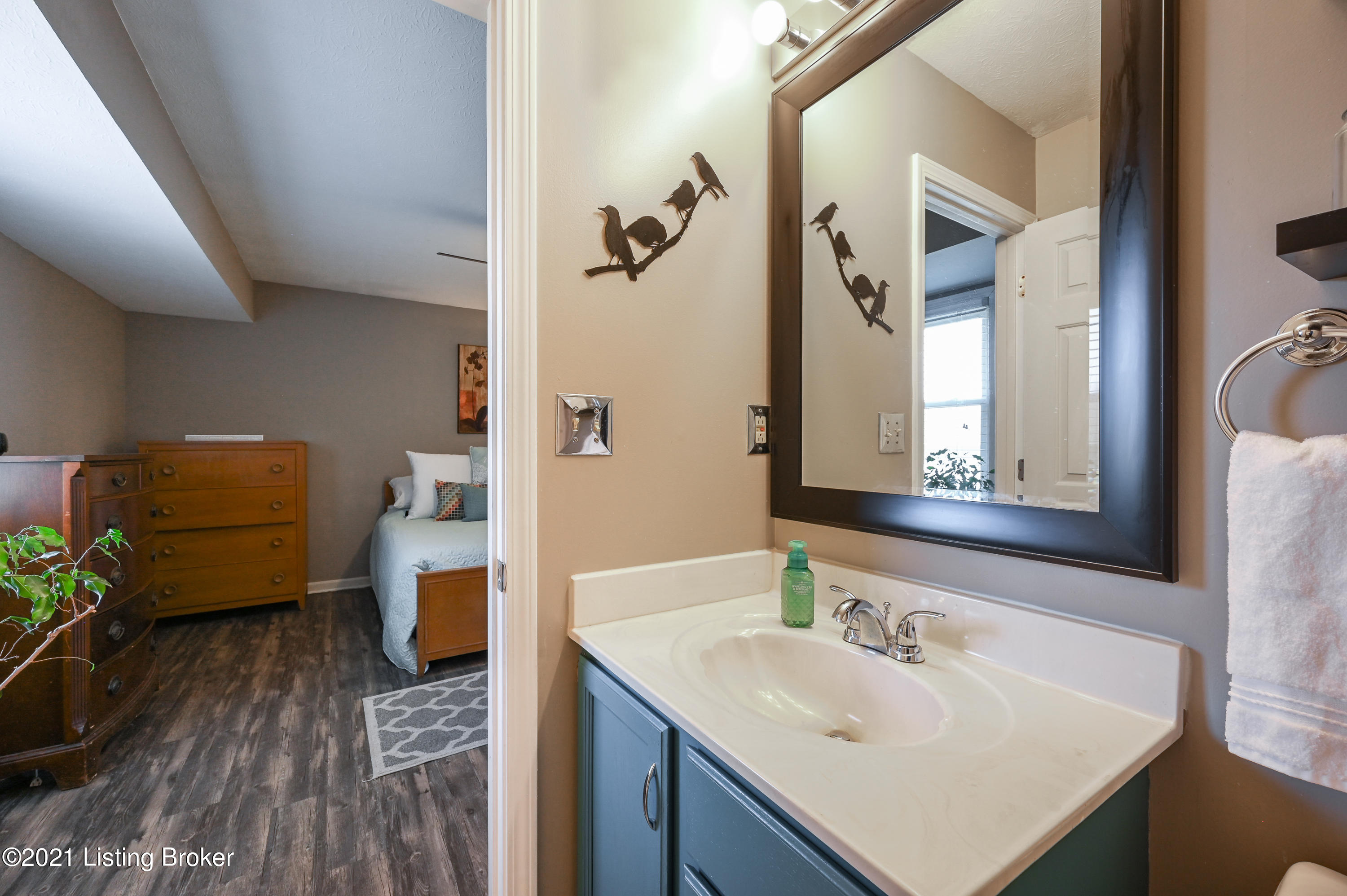 1222 Cedarbrook Road Goshen, KY 40026 - Photo 24 of 46 The en suite bath features a shower/tub combo, a vanity with plenty of storage space, a large wood framed mirror, and beautiful sconce lighting