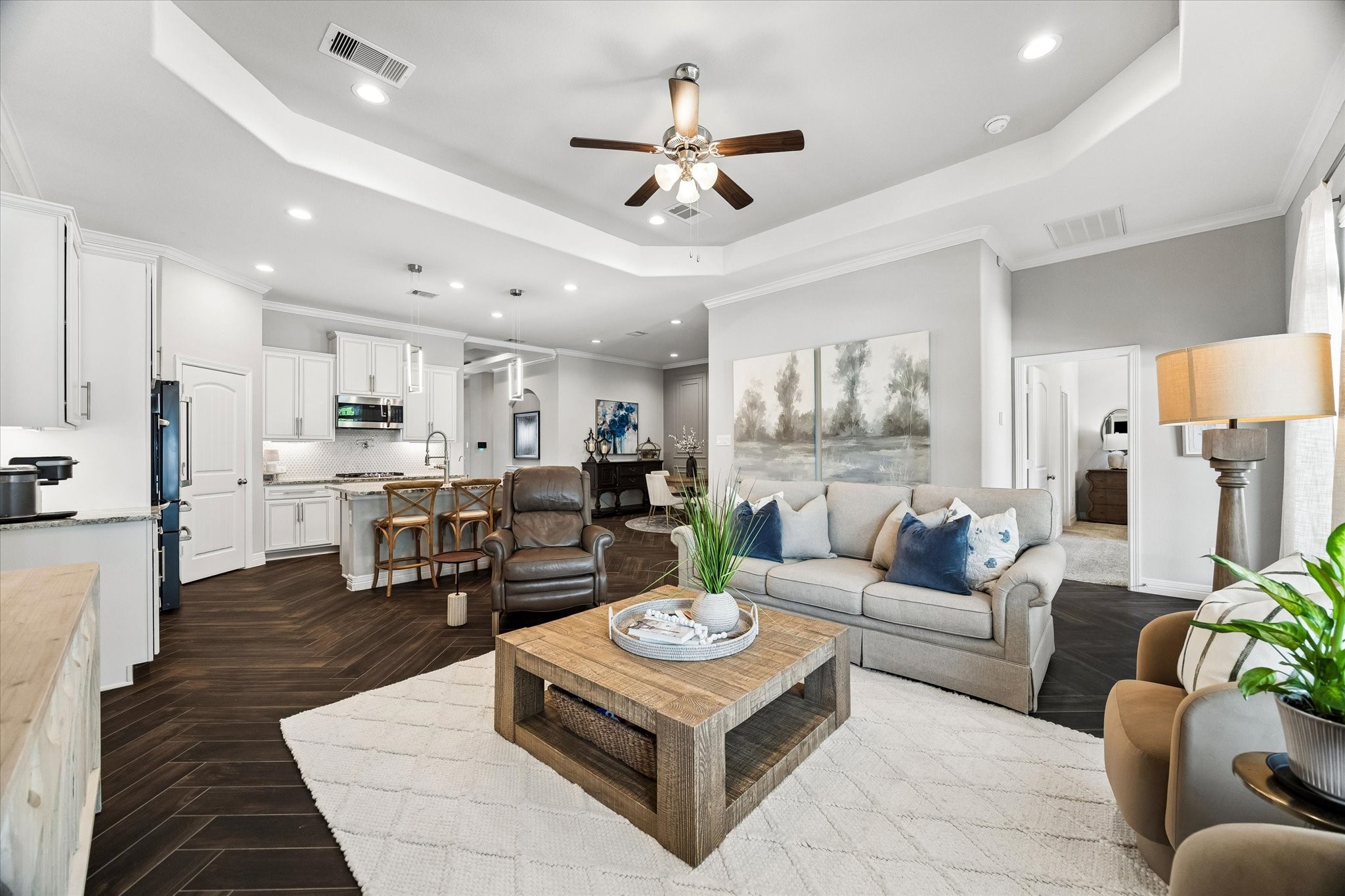 5935 Dovershire Knoll Court Spring, TX 77389 - Photo 15 of 34 a living room with furniture kitchen view and a chandelier
