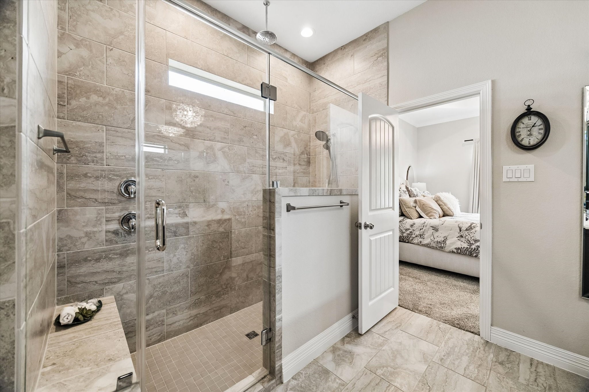 5935 Dovershire Knoll Court Spring, TX 77389 - Photo 18 of 34 a bathroom with a glass shower door and a sink