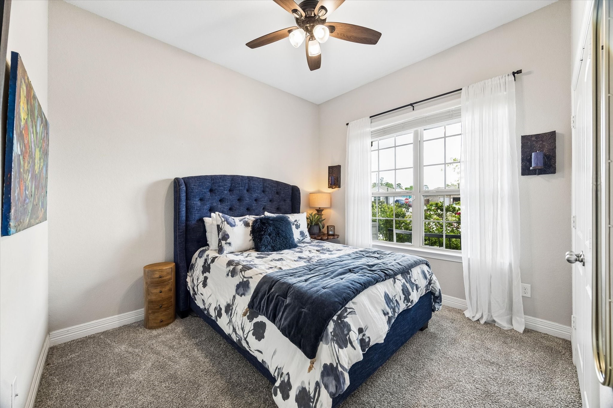 5935 Dovershire Knoll Court Spring, TX 77389 - Photo 21 of 34 a bedroom with a bed and window