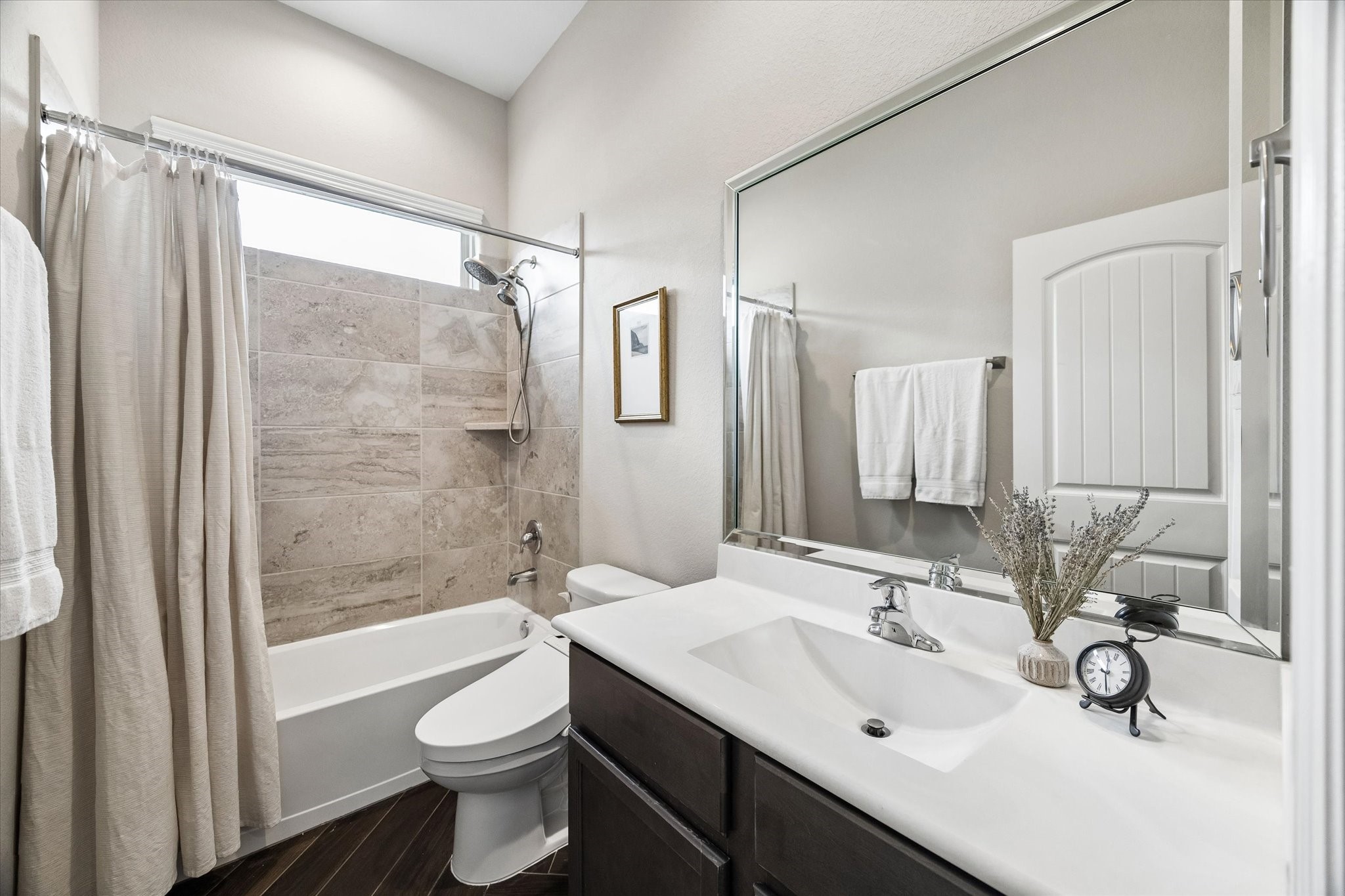 5935 Dovershire Knoll Court Spring, TX 77389 - Photo 22 of 34 a bathroom with a sink toilet and shower