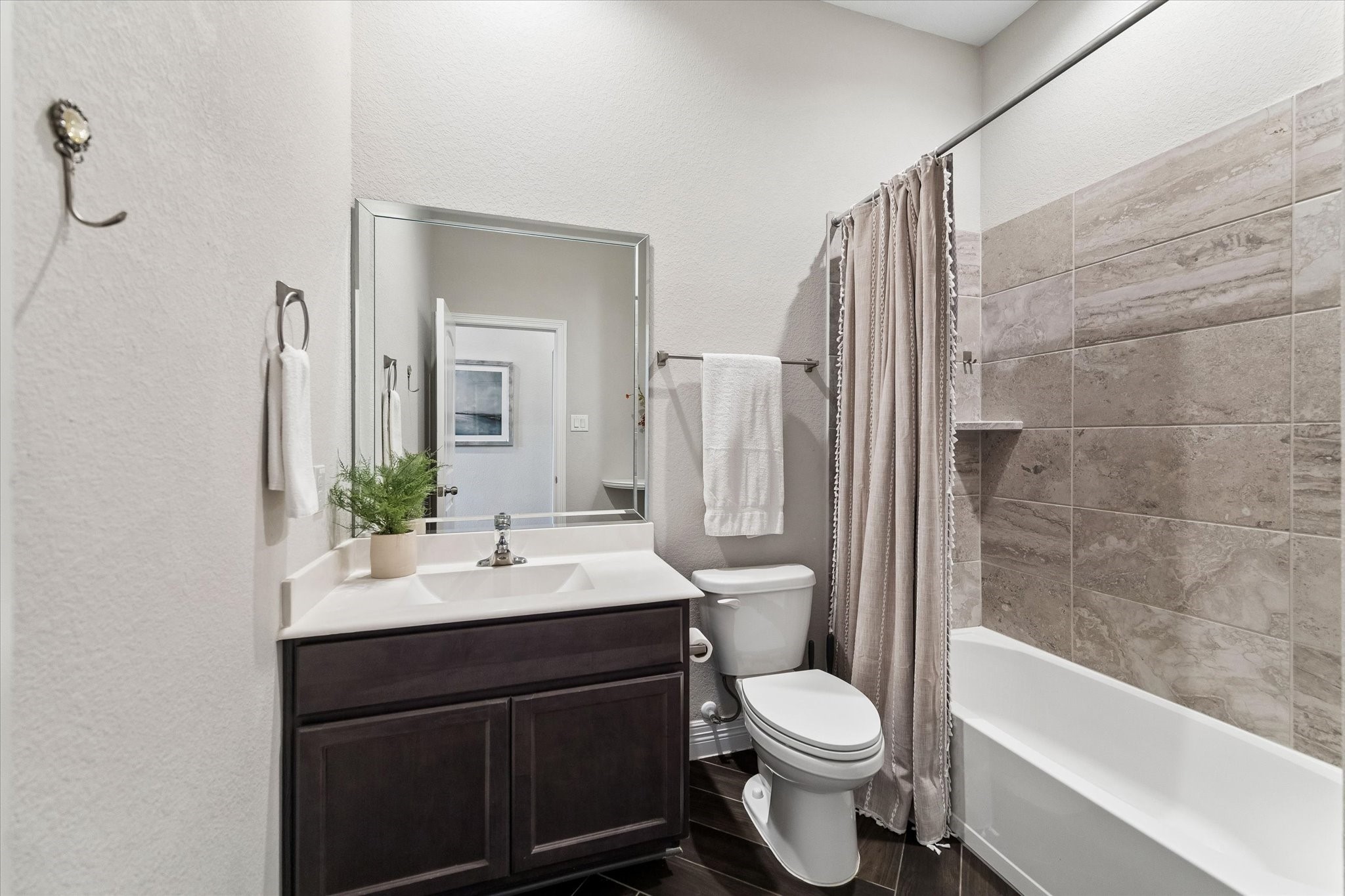 5935 Dovershire Knoll Court Spring, TX 77389 - Photo 23 of 34 a bathroom with a sink toilet and shower