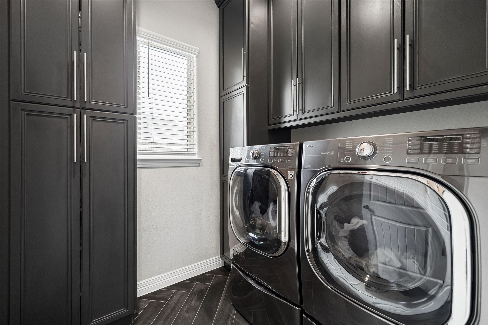 5935 Dovershire Knoll Court Spring, TX 77389 - Photo 24 of 34 a utility room with dryer and washer