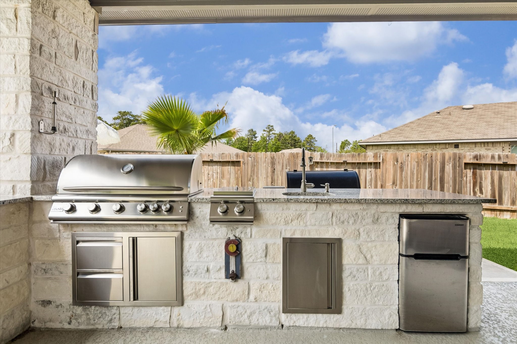 5935 Dovershire Knoll Court Spring, TX 77389 - Photo 28 of 34 a kitchen with a stove and a white cabinet