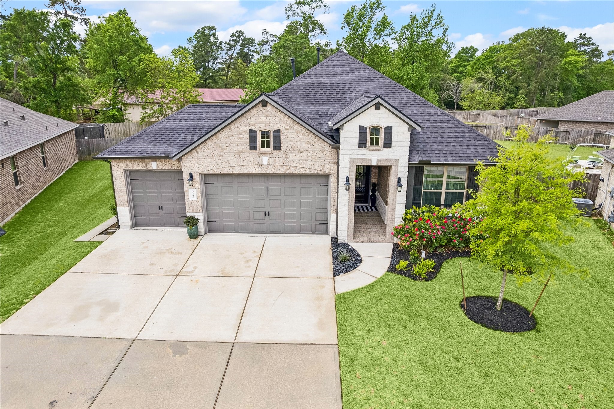 5935 Dovershire Knoll Court Spring, TX 77389 - Photo 3 of 34 a house view with a garden space