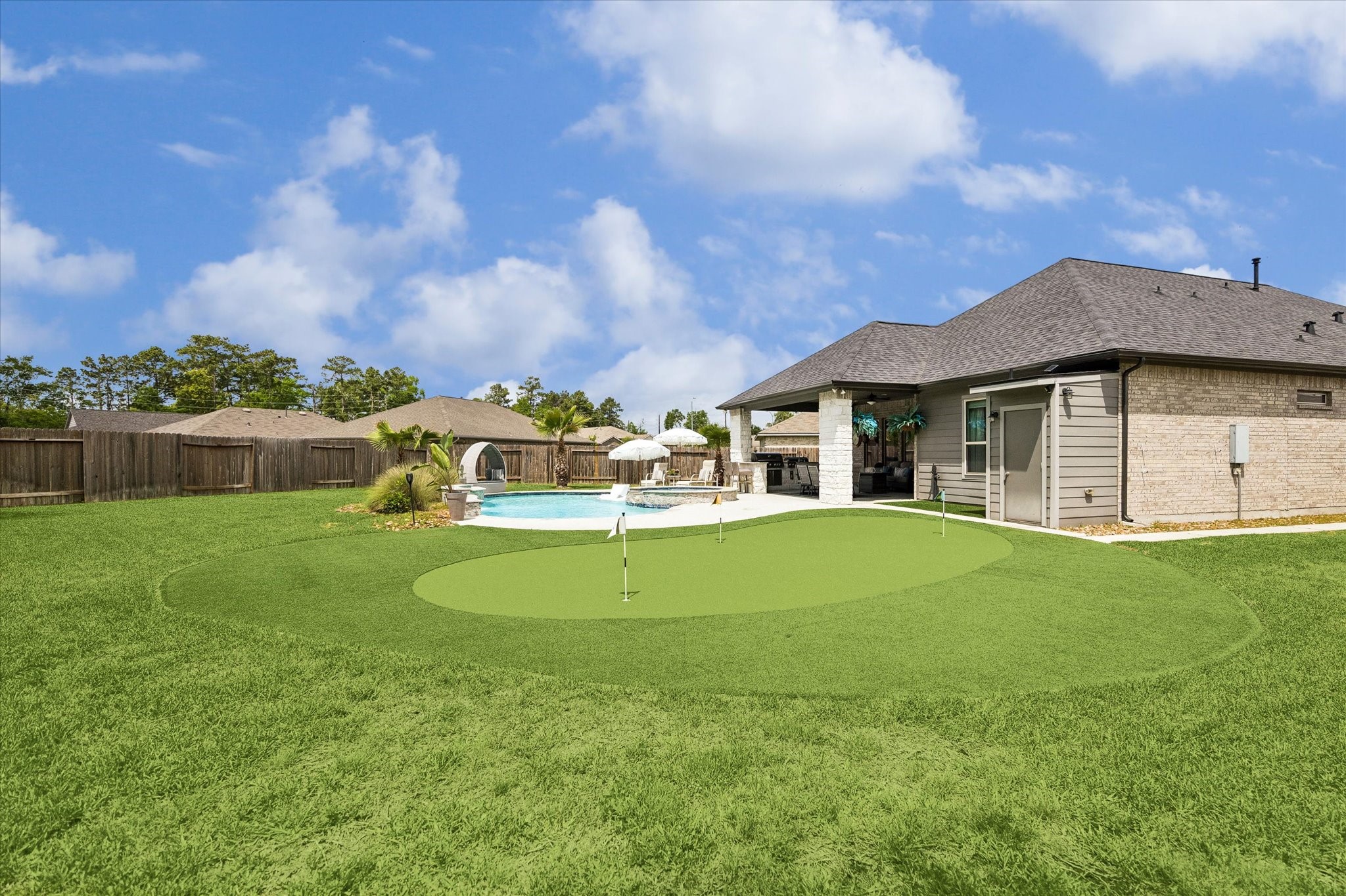 5935 Dovershire Knoll Court Spring, TX 77389 - Photo 31 of 34 a front view of a house with a garden