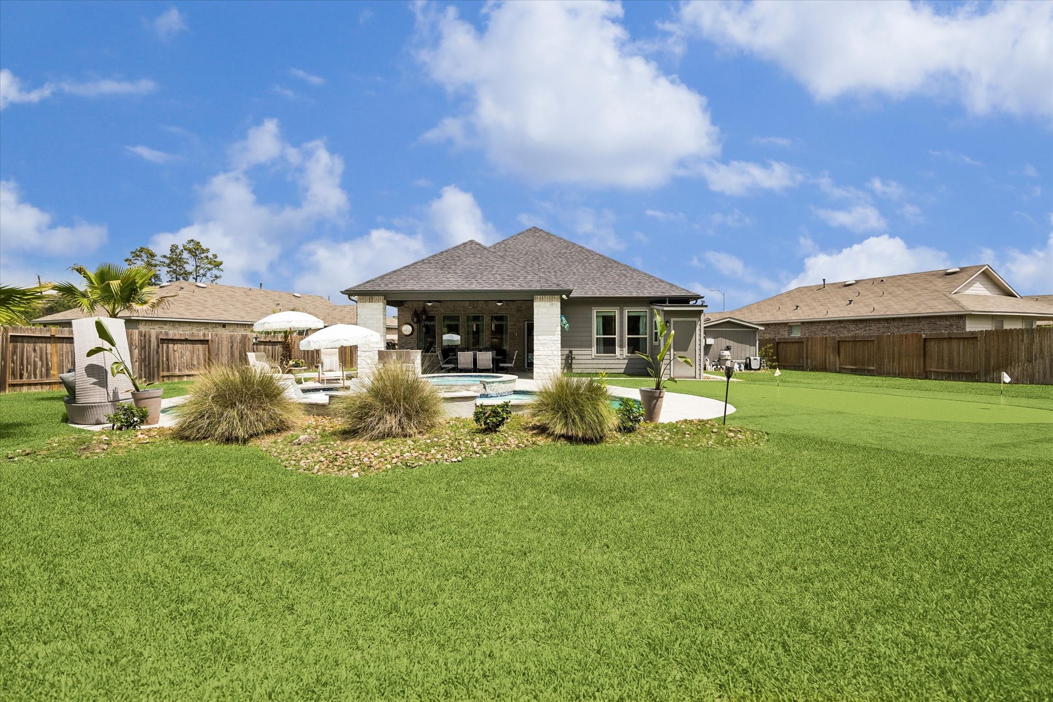 5935 Dovershire Knoll Court Spring, TX 77389 - Photo 32 of 34 a view of a house with a big yard