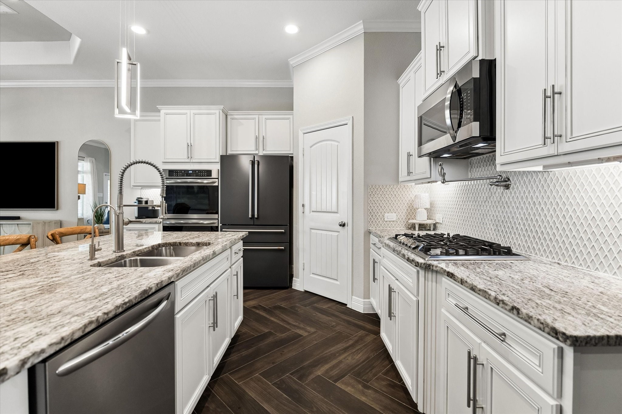 5935 Dovershire Knoll Court Spring, TX 77389 - Photo 8 of 34 a kitchen with stainless steel appliances granite countertop a sink stove and refrigerator