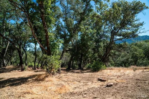a view of mountain view with lots of trees