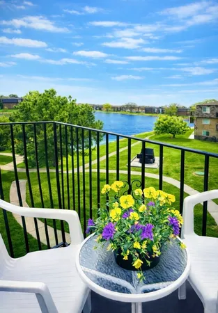 a view of a chairs and table in the garden